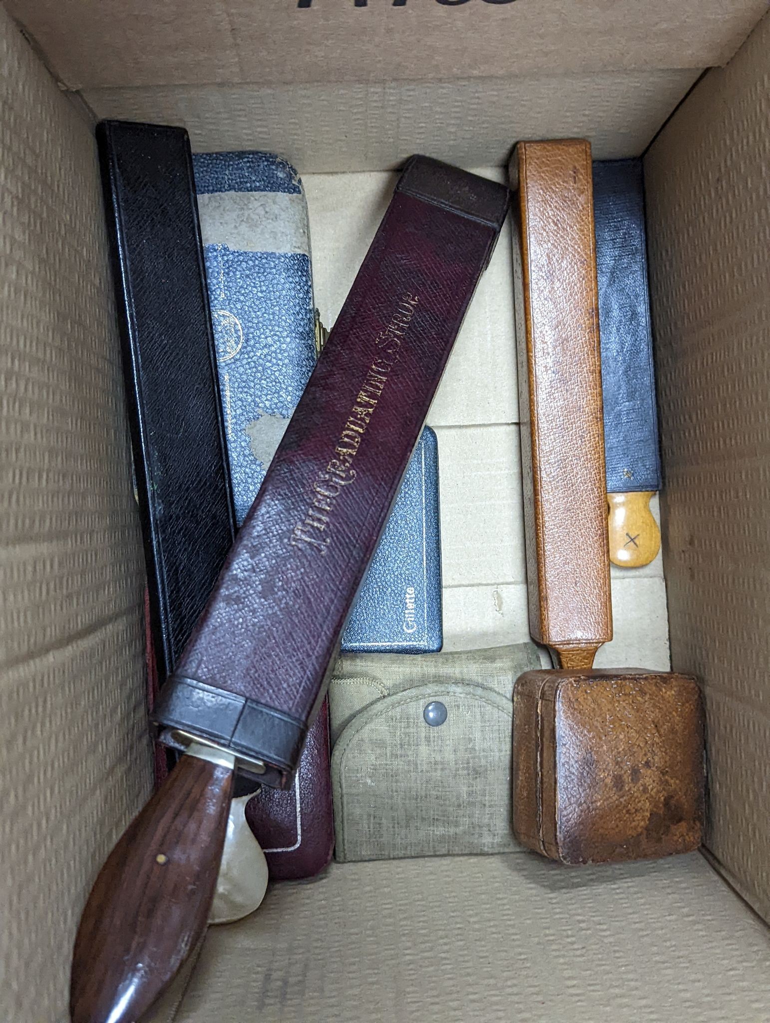 A group of cased vintage safety razors and shavers and four strops